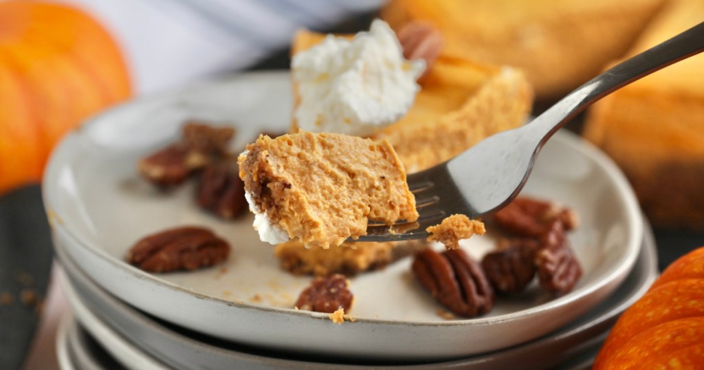 bite of pumpkin cheesecake on a fork