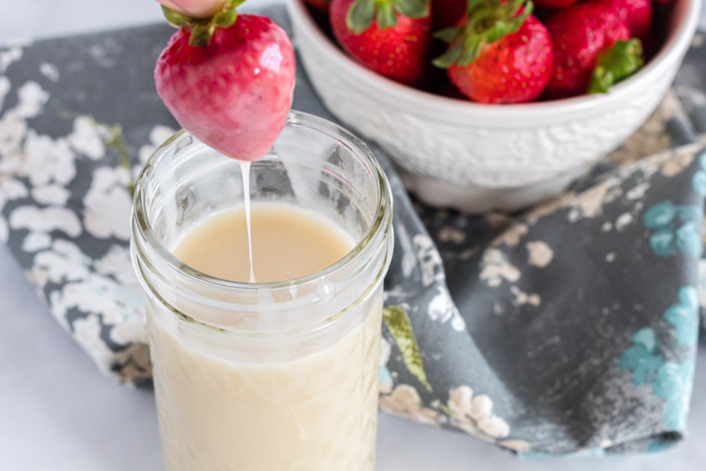 dipped strawberry into homemade condensed coconut milk