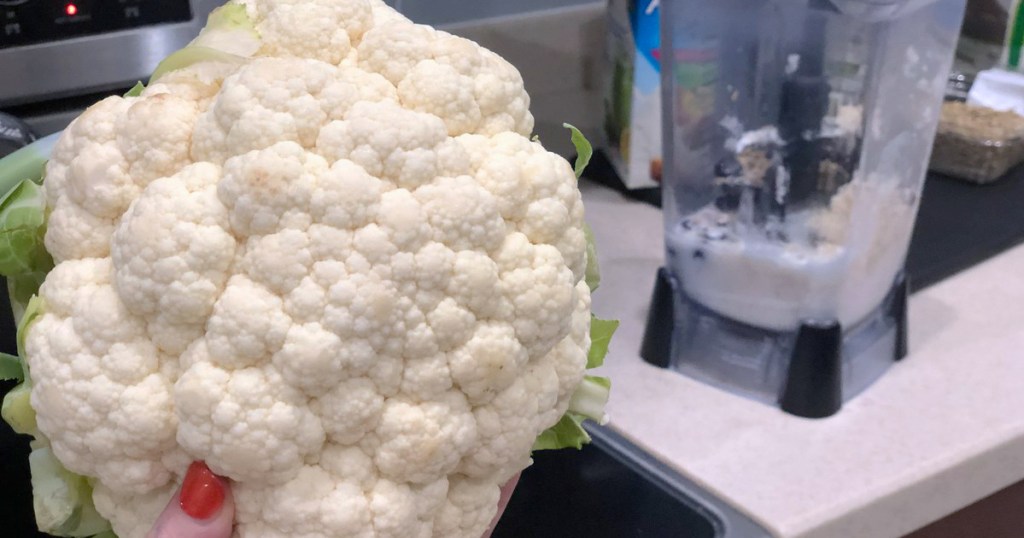 cauliflower head in front of blender