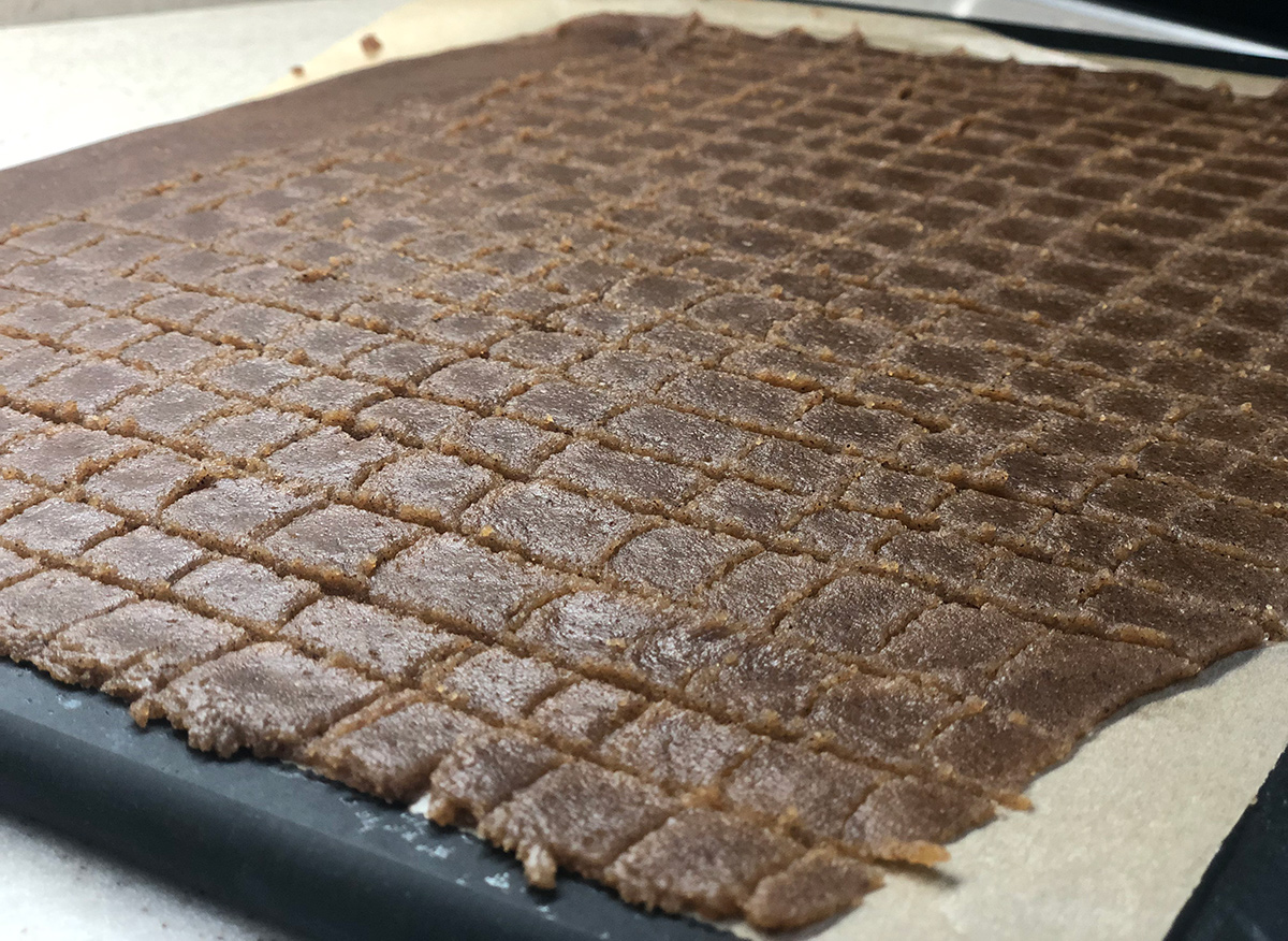 keto cinnamon cereal dough on pan cut into squares