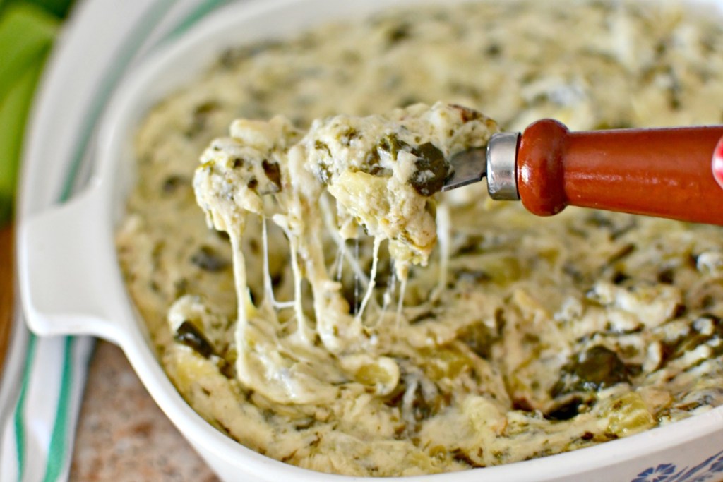 knife dipped in keto artichoke dip