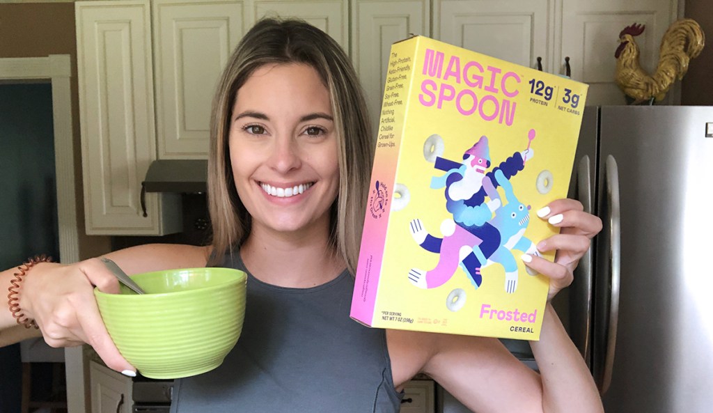 woman holding frosted magic spoon cereal box 
