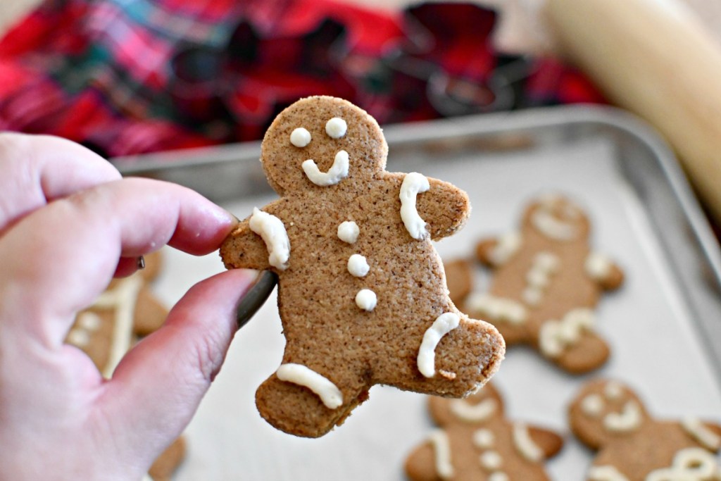 keto gingerbread cookie held in hand