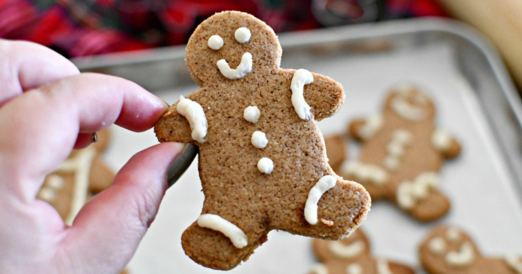 holding up a keto gingerbread cookie