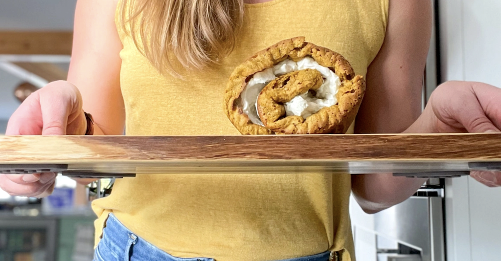 holding keto pumpkin roll on tray