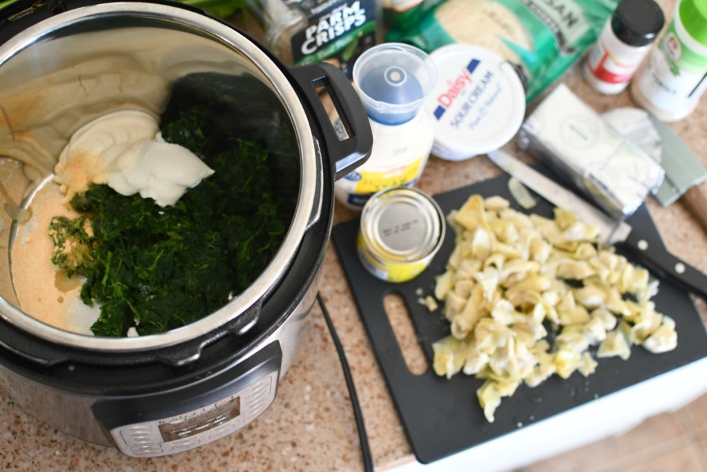 instant pot on counter with artichoke dip