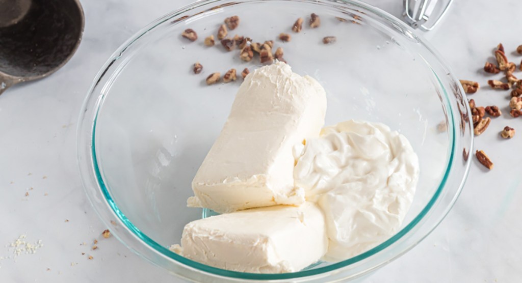 cream cheese and sour cream in mixing bowl