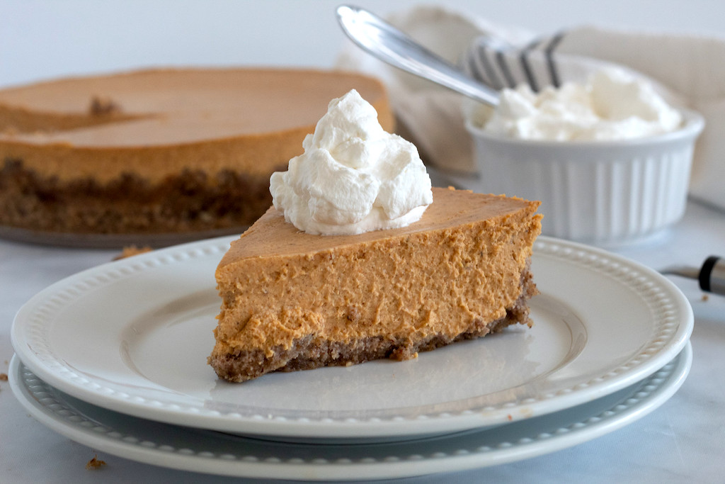 keto pumpkin cheesecake slice with whipped cream