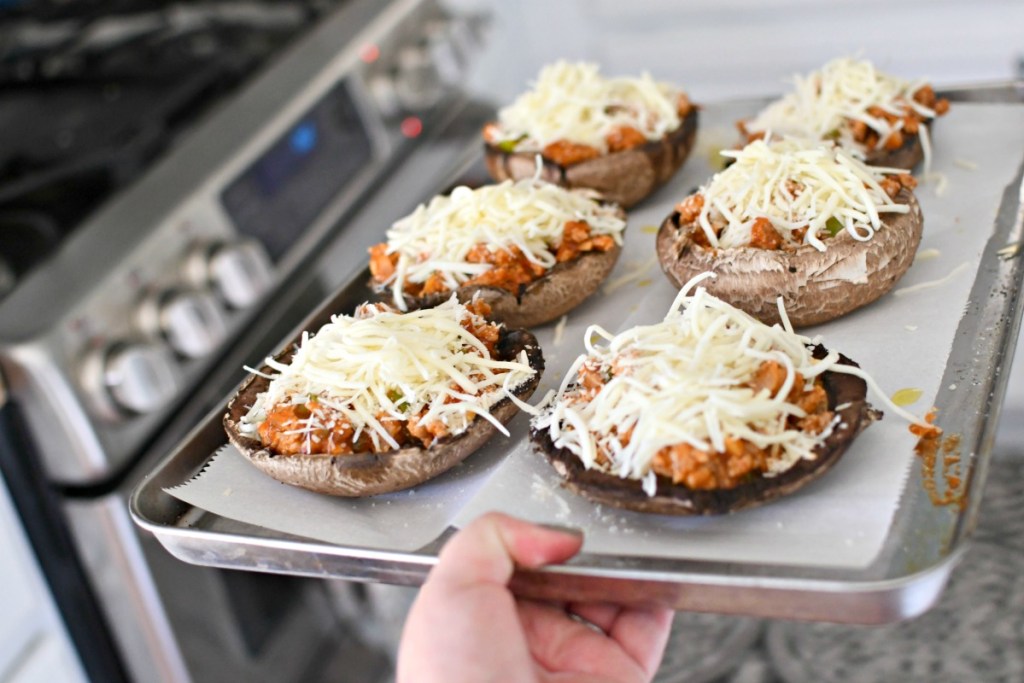 pan of keto stuffed mushrooms going into the oven