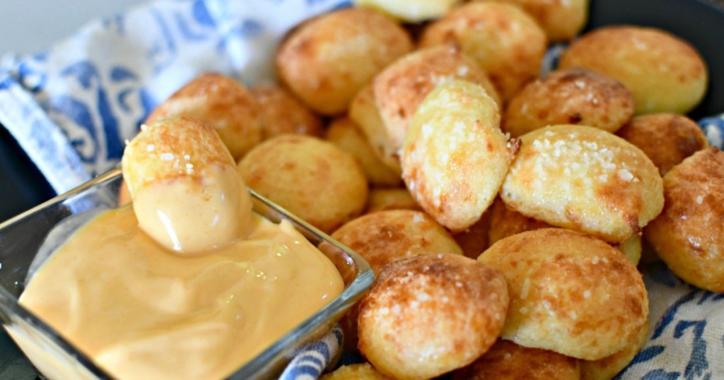 soft keto pretzel bites on a plate with cheese sauce 
