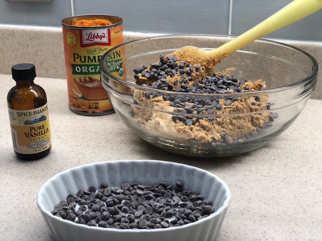 mixing in chocolate chips into keto pumpkin cookie dough