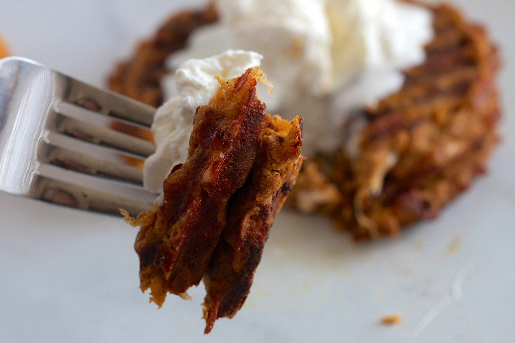 fork with keto pumpkin spiced chaffle and whipped cream 