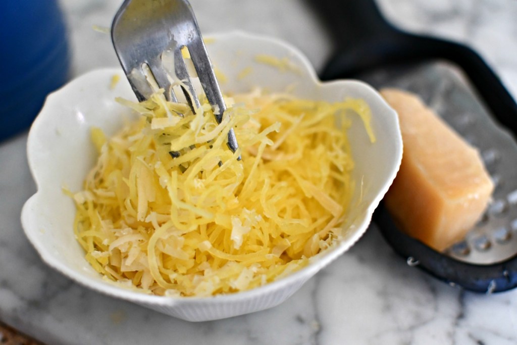 spaghetti squash with parmesan cheese on top