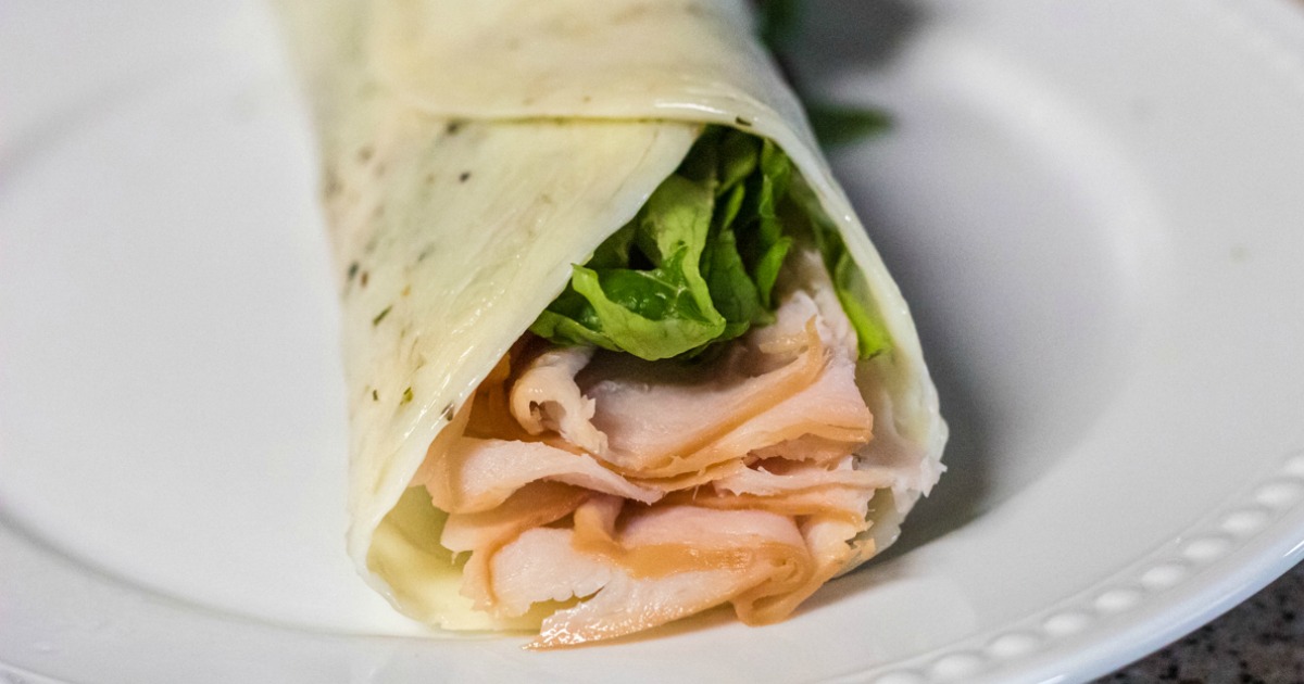 Keto Cheese Wrap with lettuce and turkey on plate