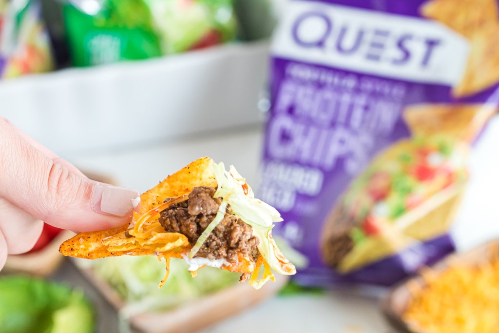 Quest chip with taco toppings on it