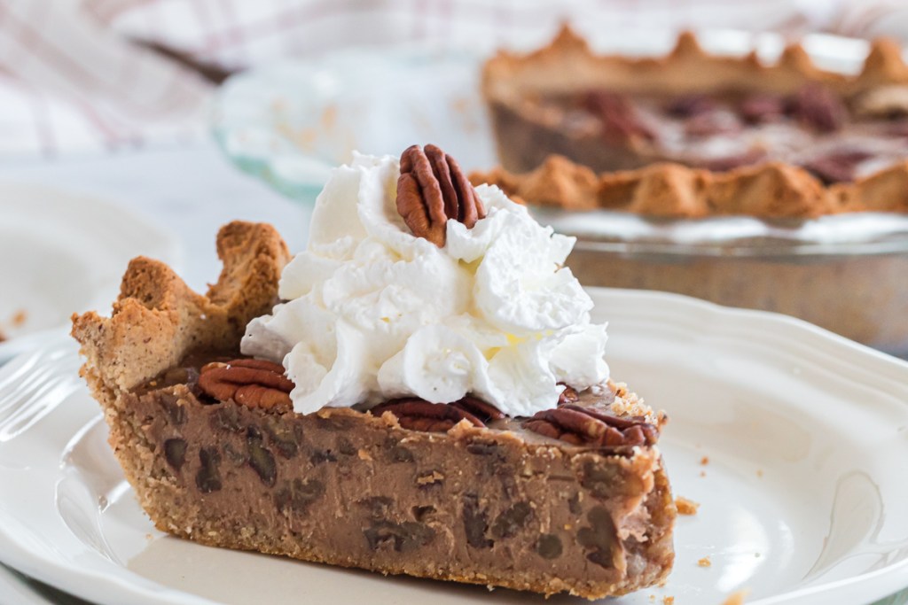 slice of pecan pie with whipped cream