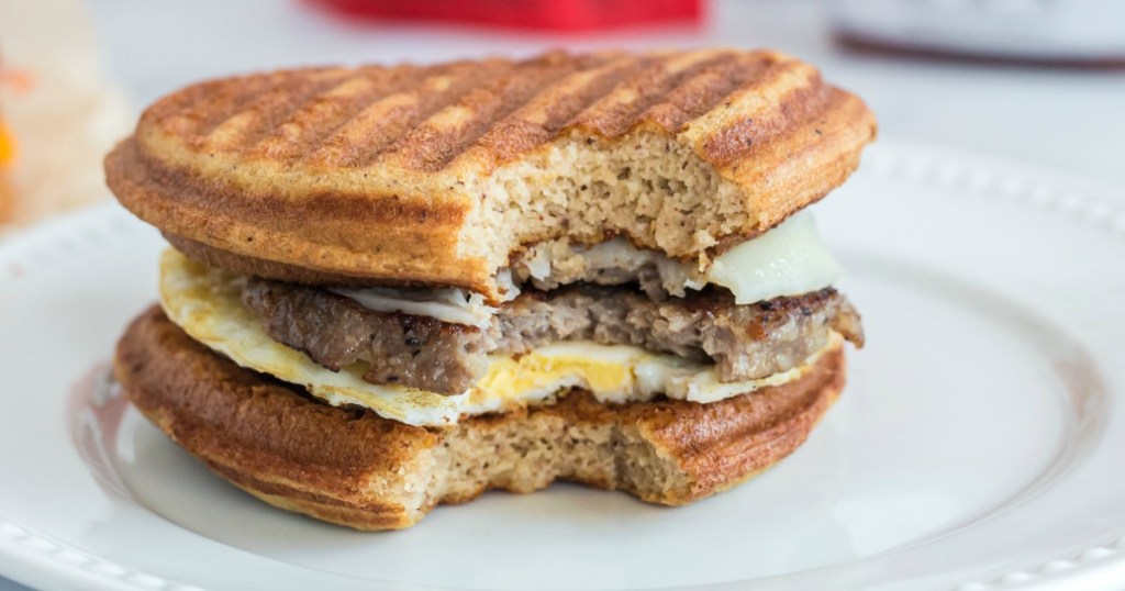 keto chaffle breakfast sandwich with sausage and egg