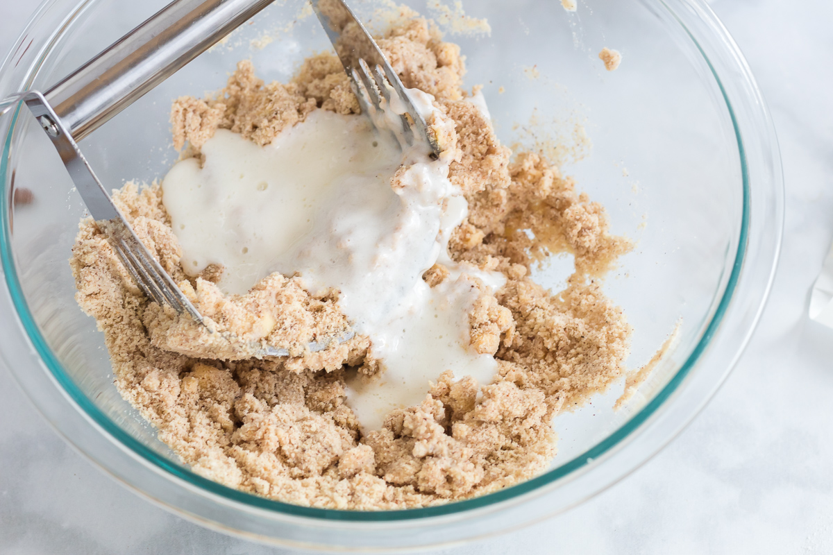 mixing wet ingredients into pie crust 