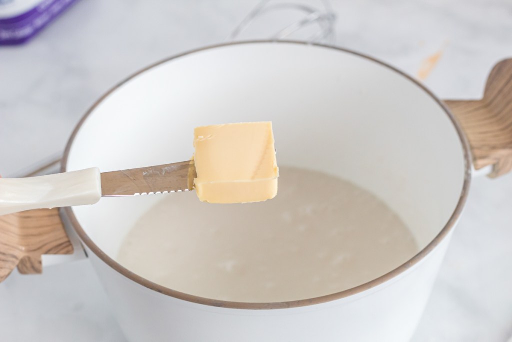 adding butter to coconut milk