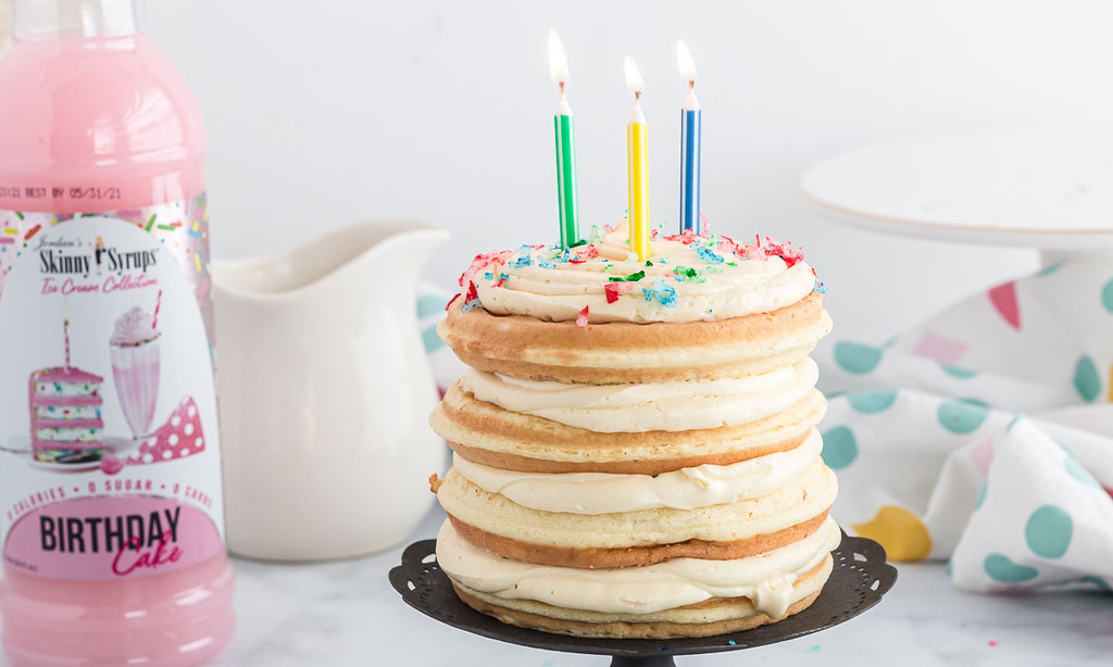 Keto chaffle birthday cake with candle lit 