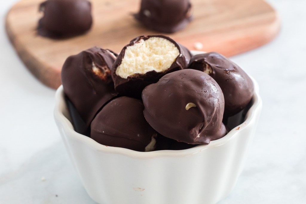 Bowl of chocolate covered cheesecake fat bombs