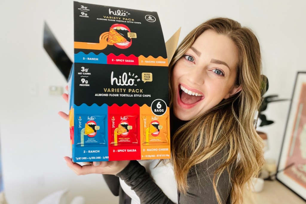 woman holding hilo tortilla chip variety pack