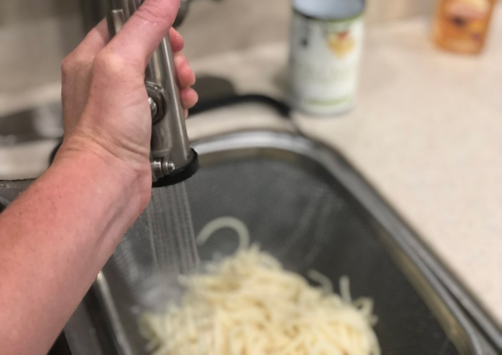 Rinsing Palmini hearts of palm pasta