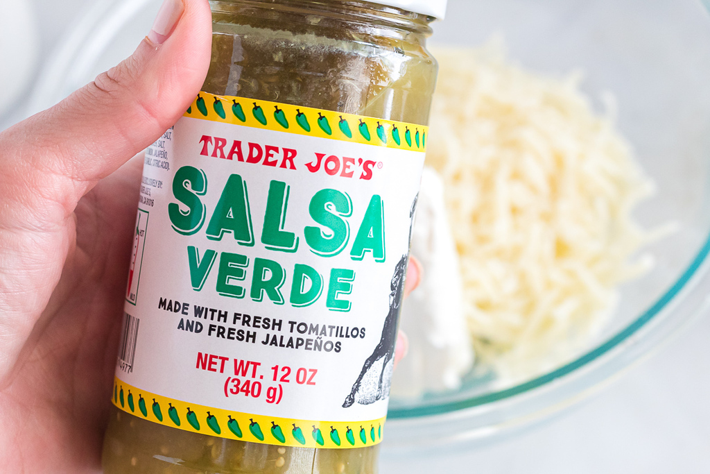 holding Trader Joe's salsa verde