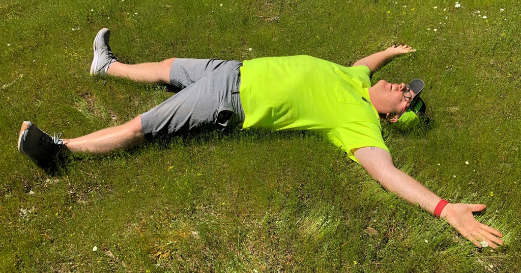 man laying on grass