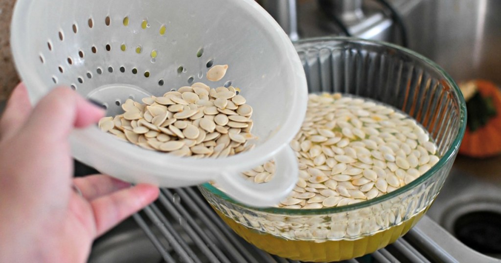 rinsing pumpkin seeds