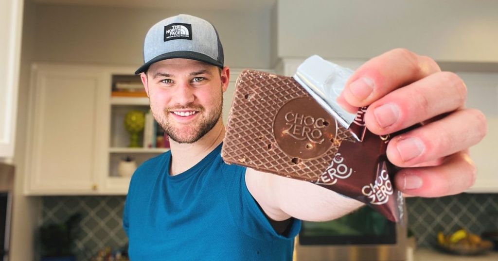 A man holding a chocolate keto bark dessert