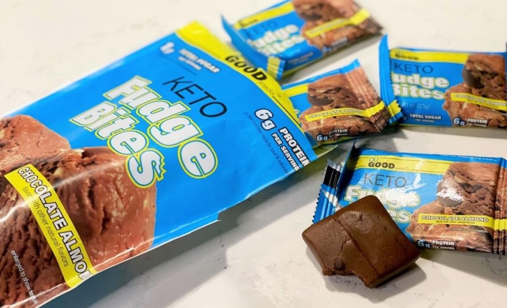 A package of keto fudge bites on the counter next to individually wrapped bites