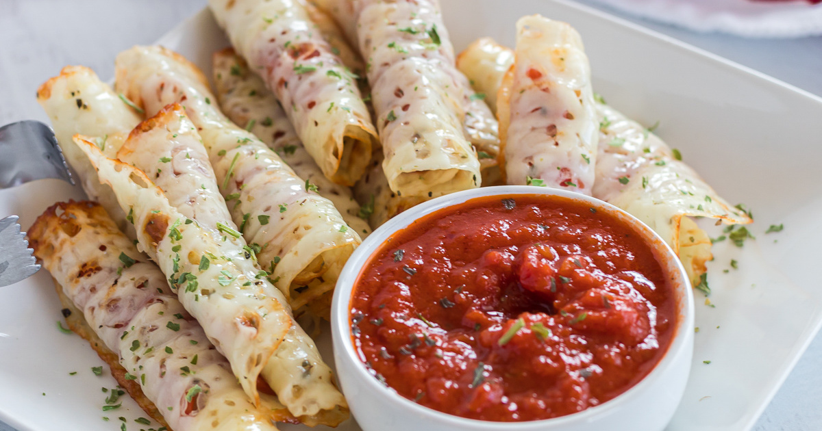 Plate of pizza roll ups and dipping sauce