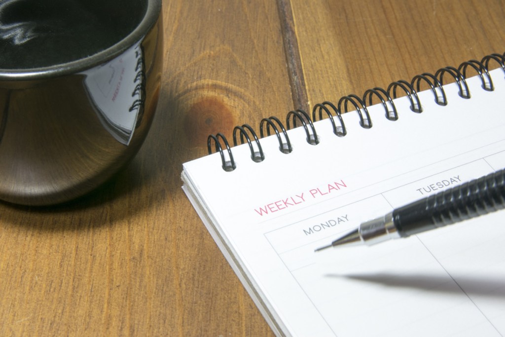 calendar on desk with cup of coffee