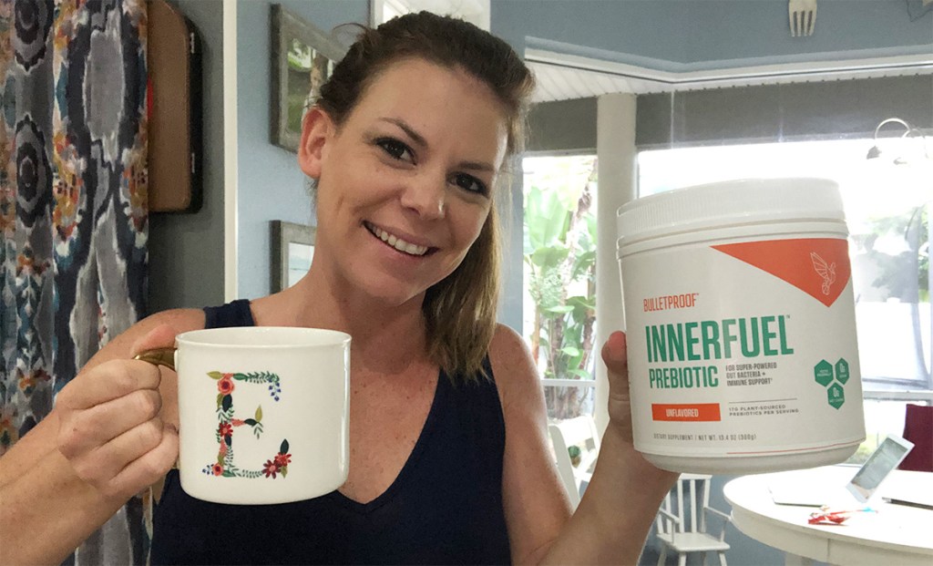 Erica with cup of coffee and Bulletproof InnerFuel Prebiotic powder