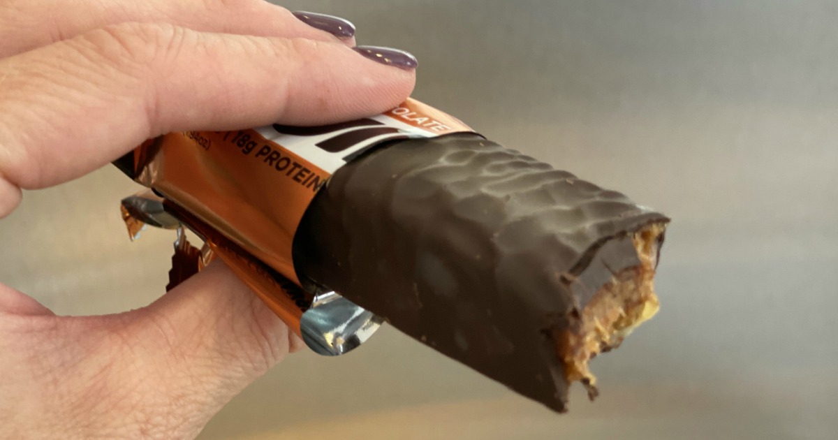 holding Built chocolate protein bar 