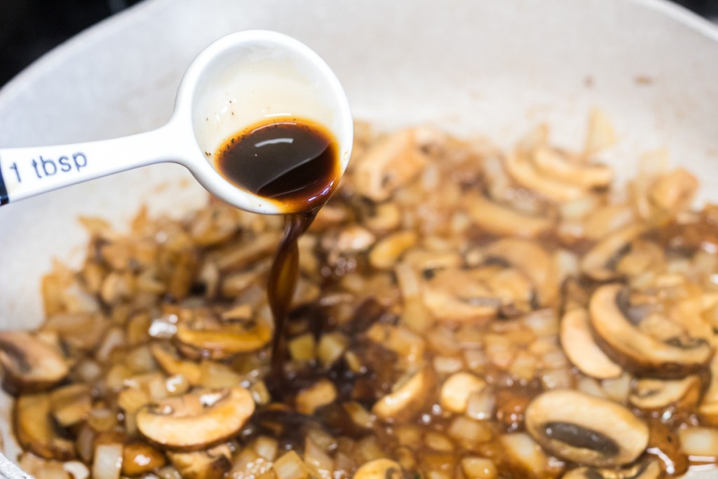 Worcestershire sauce pour into saute mushrooms