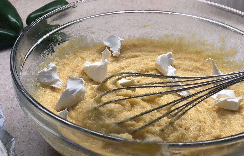 Keto cornbread batter mixing in cream cheese