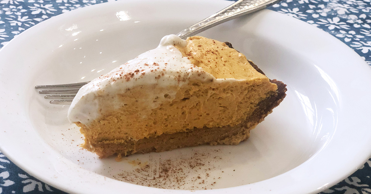 Keto Pumpkin Cream Pie slice on white plate