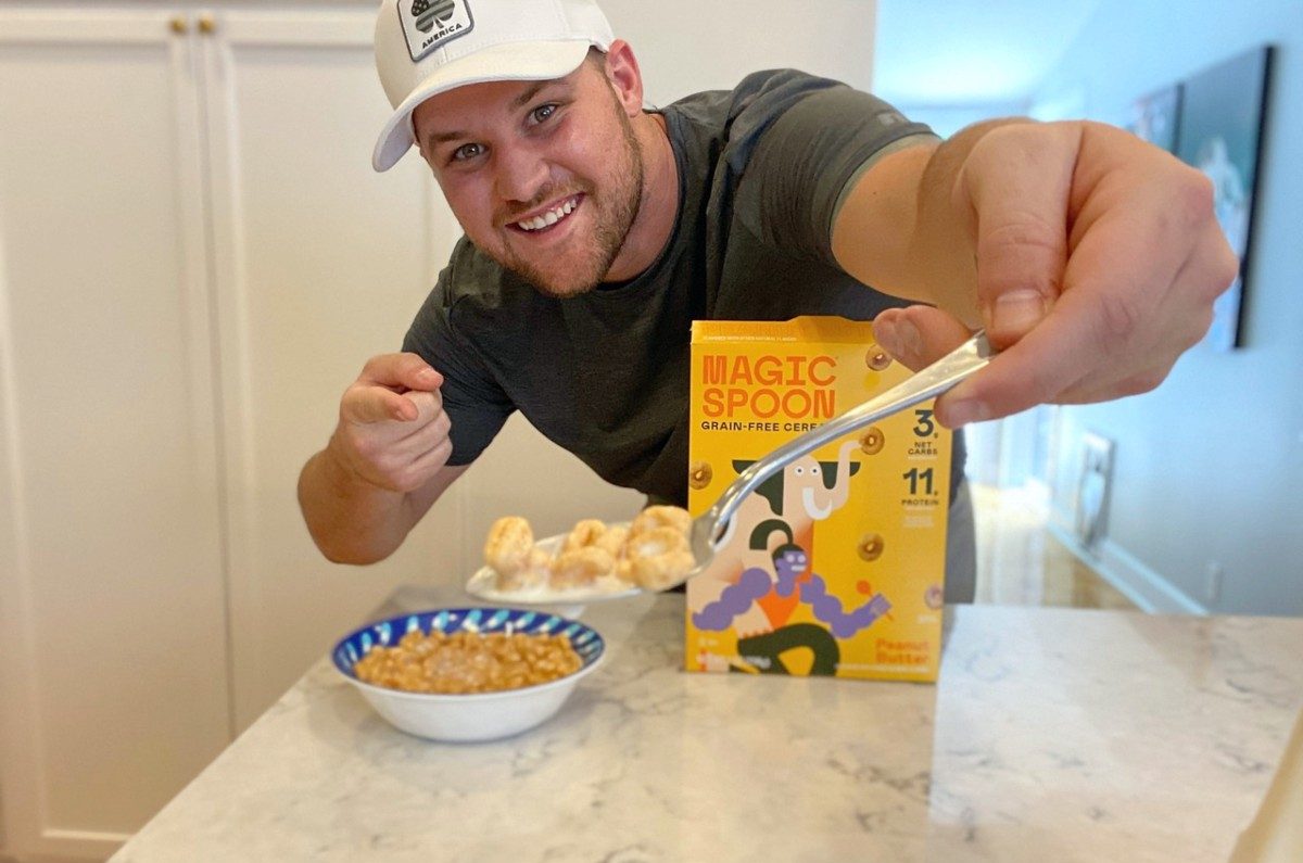 man holding spoon full of Magic Spoon peanut butter cereal