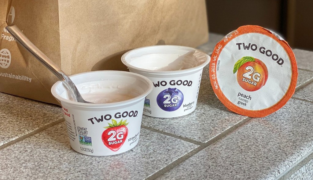 two good yogurt sitting on a counter
