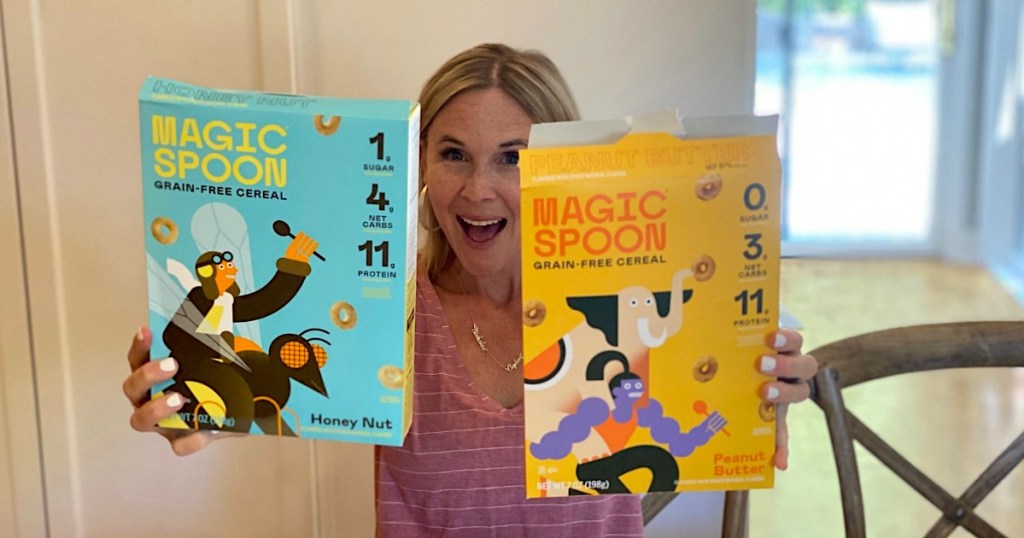 woman holding two boxes of magic spoon cereal