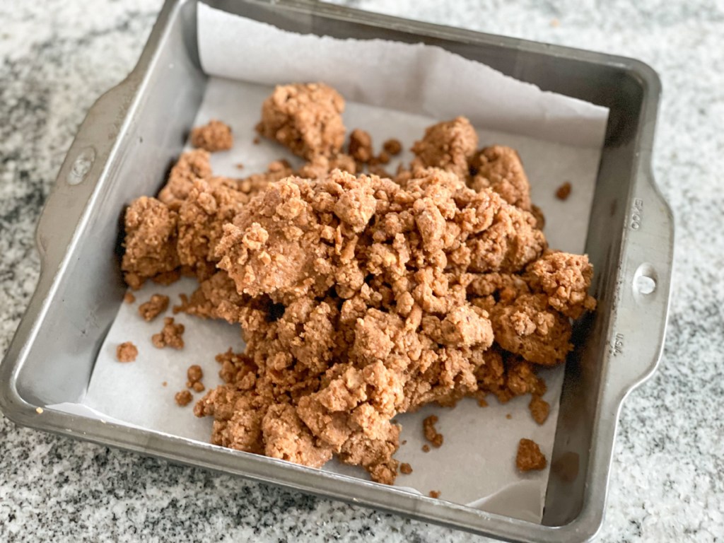 cookie dough protein bar dough in a pan 