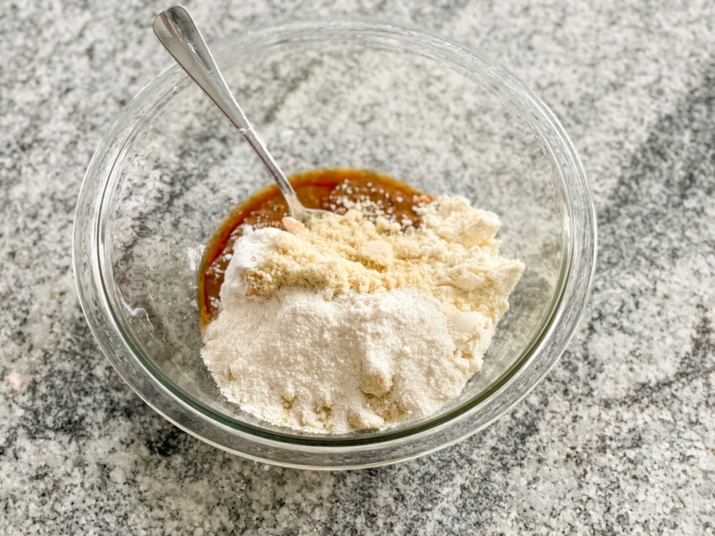 cookie dough protein bar ingredients in a mixing bowl