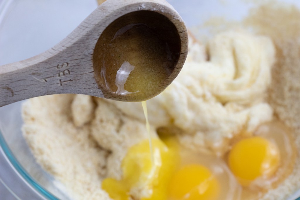 adding butter to dough for keto sweet dinner rolls