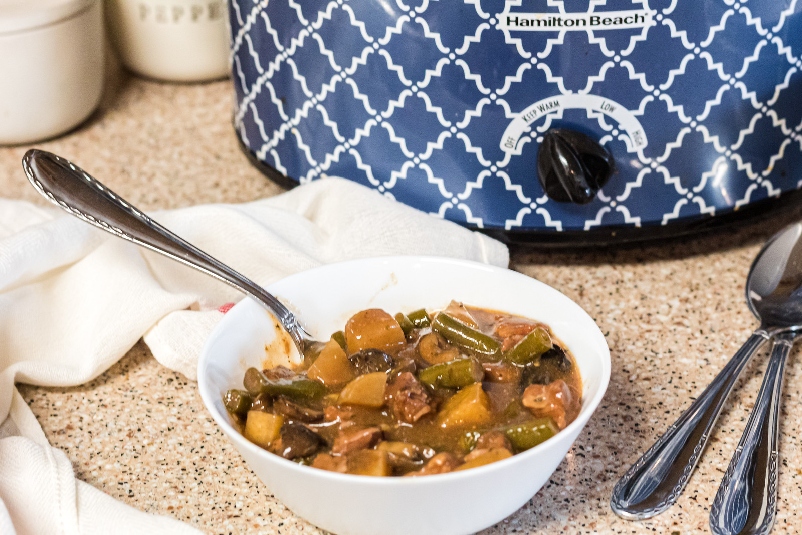 keto beef stew in a white bowl by Crockpot