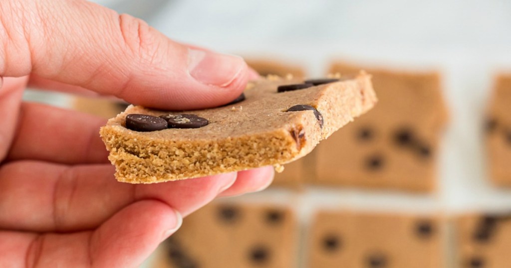 holding keto cookie dough chocolate chip protein bar