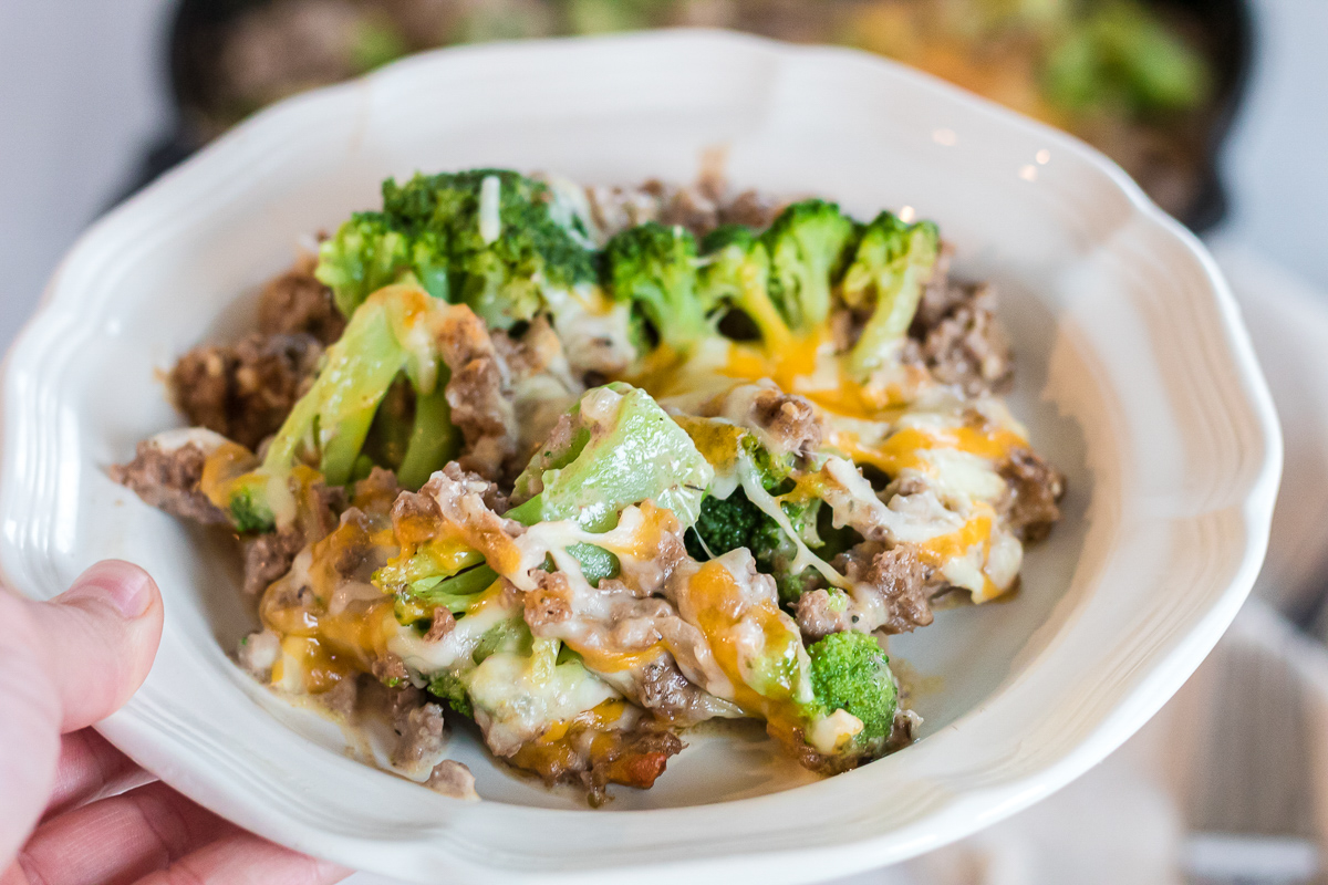 plate of cheesy hamburger meat casserole with broccoli 
