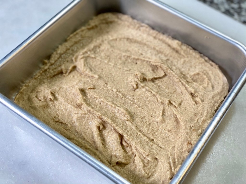 keto spice cake batter in square cake pan