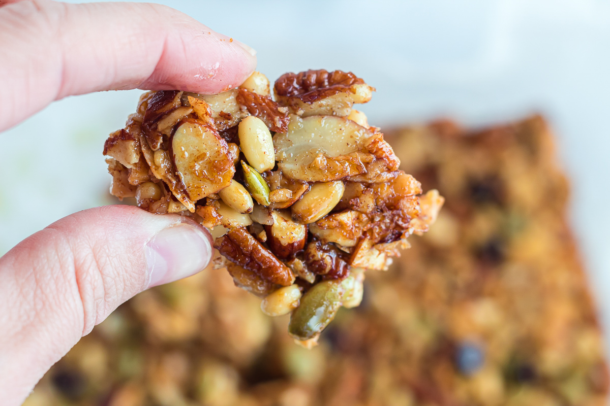 holding up chunk of keto trail mix